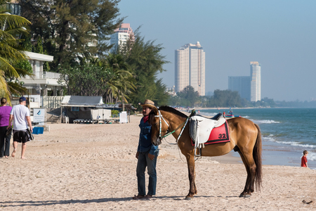 Prachuab Khirikhan, Thailand - December, 23, 2017 : Unidentified name people and a horse at Khao Takiab beach of Thailand.のeditorial素材