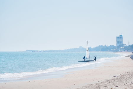 Prachuab Khirikhan, Thailand - December, 23, 2017 : Unidentified name people Sailboat yacht boat sail sea ocean water horizon summer travel sport beach sand shore wave sail  at Khao Takiab beach of Thailand.のeditorial素材