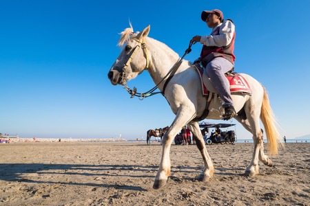 Prachuab Khirikhan, Thailand - December, 23, 2017 : Unidentified name people riding a horse at Khao Takiab beach of Thailand.のeditorial素材