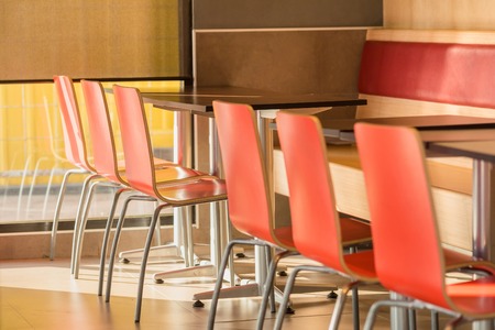 Chairs and table in restaurant backgroundの写真素材