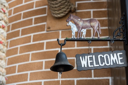 Grunge metal welcome sign hanging. selective focusの写真素材