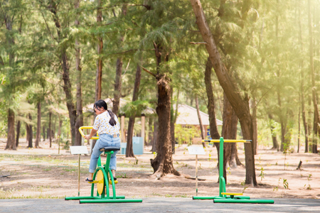Prachuab Khirikhan, Thailand - March, 25, 2018 : Unidentified name woman playing exercise equipment in public park at Prachuab Khirikhan, Thailandのeditorial素材