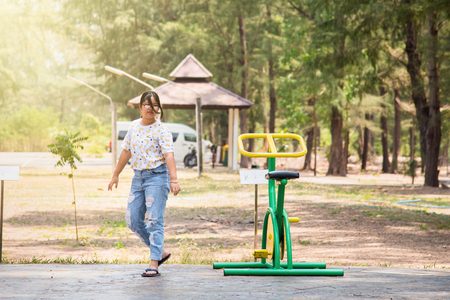 Prachuab Khirikhan, Thailand - March, 25, 2018 : Unidentified name woman playing exercise equipment in public park at Prachuab Khirikhan, Thailandのeditorial素材