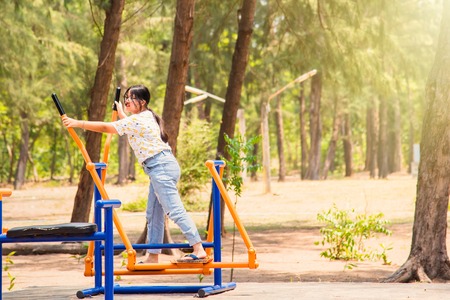 Prachuab Khirikhan, Thailand - March, 25, 2018 : Unidentified name woman playing exercise equipment in public park at Prachuab Khirikhan, Thailandのeditorial素材