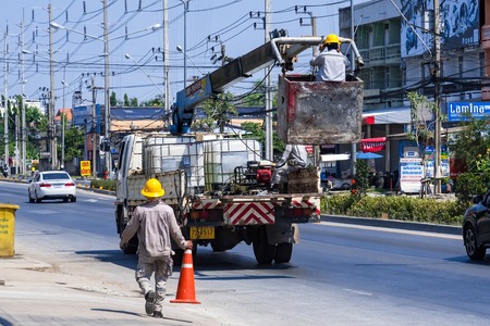 Nonthaburi, Thailand - April, 14, 2018 : Cranes basket car of electrician on the road at Nonthaburi, Thailandのeditorial素材
