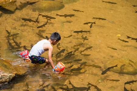 Chanthaburi, Thailand - April, 27, 2018 : Unidentified name people visitors come to play water at Chanthaburi Waterfall National Park(Pliw waterfall) Chantaburi province, Thailandのeditorial素材