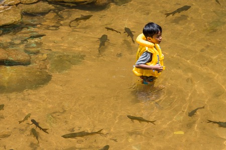 Chanthaburi, Thailand - April, 27, 2018 : Unidentified name people visitors come to play water at Chanthaburi Waterfall National Park(Pliw waterfall) Chantaburi province, Thailandのeditorial素材