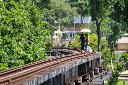 Kanchanaburii, Thailand - May, 13, 2018 : Unidentified tourists walking and taking photos on World war II historic railway, known as the Death Railway at Kanchanaburii, Thailandのeditorial素材