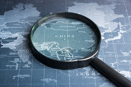 Magnifying glass on the world map.Business exploration system conceptの写真素材