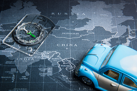Nonthaburi, Thailand - May, 26, 2018 : Volkswagen Beetle car and compass on the world map at...