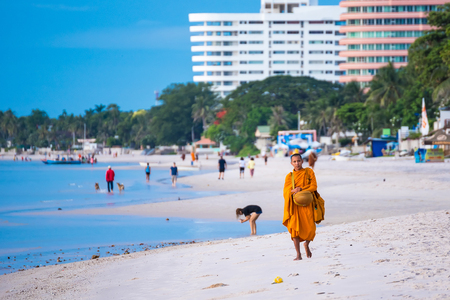 Prachuap Khiri Khan,Thailand - June, 03, 2018 : Unidentified name buddhist monk was walking alms offering food in the morning on the beach at Hua Hin Beach Prachuab Khirikhan, Thailand.のeditorial素材