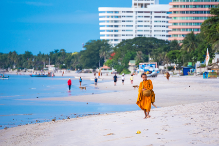Prachuap Khiri Khan,Thailand - June, 03, 2018 : Unidentified name buddhist monk was walking alms offering food in the morning on the beach at Hua Hin Beach Prachuab Khirikhan, Thailand.のeditorial素材