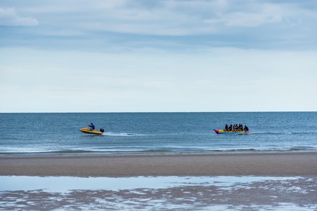 Prachuap Khiri Khan,Thailand - June, 02, 2018 : Unidentified name Group of tourists are enjoy and exciting on banana boat in sunset time at Khao Takiab beach of Thailand.のeditorial素材