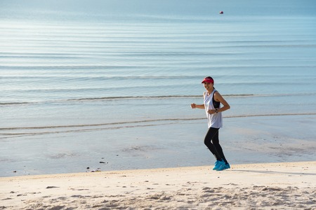 Prachuap Khiri Khan,Thailand - June, 03, 2018 : Unidentified running man on beach. Sportsman run jogging guy during the sunrise above sandy beach at Hua Hin Beach Prachuab Khirikhan, Thailand.のeditorial素材