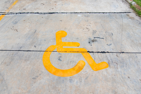 Disabled parking permit sign painted on the street.Thailandの写真素材