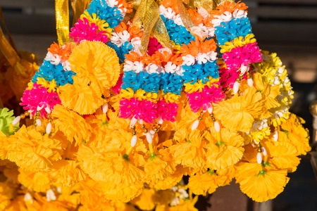 Colorful marigold flower garlands for the worship of the sacredの写真素材