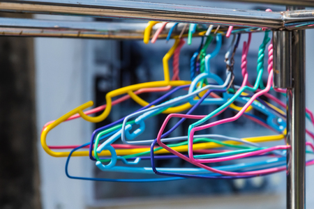 Colorful clothes hanger selective focus in day timeの写真素材