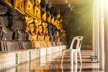 White plastic chair in Wat Suthat Devaravaram temple royal temple at the Giant Swing in Bangkok landmark of Bangkok, Thailandの写真素材