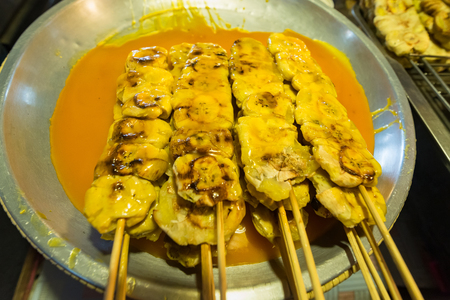 Closeup of banana toast and and coconut sauce in the trayの写真素材