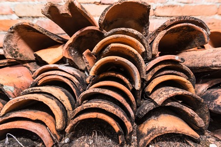 A Big Pile Of Temple Roof Tiles At The Buddha Temple With White Wall Background.Thailandの写真素材