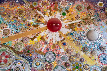 Sculpture decorative on cement wall ,using glass and ceramic at the Wat-Pha-Kaew, Phetchabun...