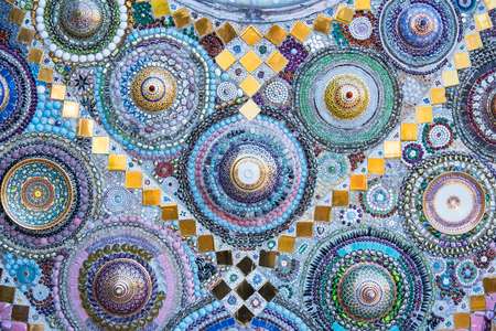 Sculpture decorative on cement wall ,using glass and ceramic at the Wat-Pha-Kaew, Phetchabun Province, Thailandの写真素材