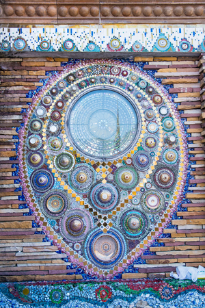 Sculpture decorative on cement wall ,using glass and ceramic at the Wat-Pha-Kaew, Phetchabun Province, Thailandの写真素材