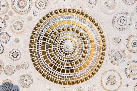 Sculpture decorative on cement wall ,using glass and ceramic at the Wat-Pha-Kaew, Phetchabun Province, Thailandの写真素材
