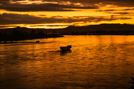 In the morning, the sun rises on the banks of the Mekong River in the Golden Triangle, Chiang Rai, Thailand.の写真素材