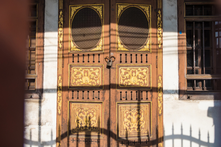 CloseUp image of old door with circle iron door-handle.Phuket.Thailandの写真素材