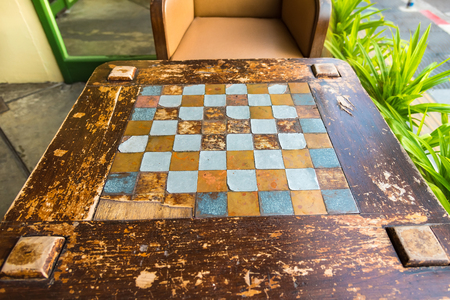 Chess game table with empty benches in the park.Thailandの写真素材