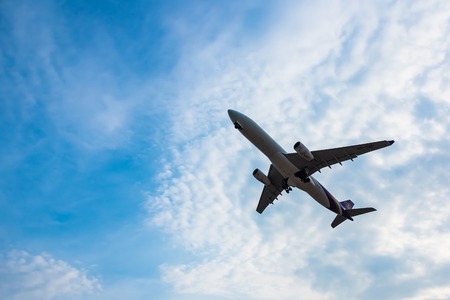 Phuket, Thailand - March, 29, 2019 : Airplane over the sea with blue sky landing to Phuket airport at Mai Khao beach.Phuket, Thailandのeditorial素材