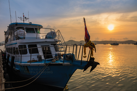 Phuket, Thailand - March, 30, 2019 : Many boats moored in sunrise morning time at Chalong port, Main port for travel ship to krabi and phi phi island, Phuket, Thailandのeditorial素材