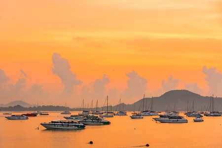Phuket, Thailand - March, 30, 2019 : Many boats moored in sunrise morning time at Chalong port, Main...
