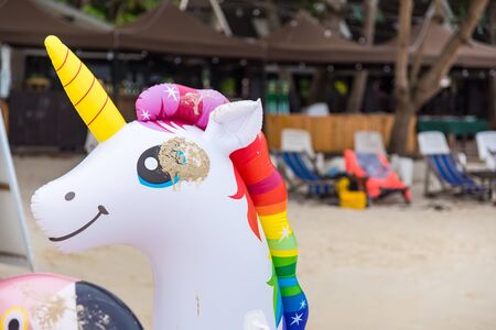 Rayong, Thailand - May, 10, 2019 : Animal figure swim tube on the beach Inflatable animal.Fantasy...