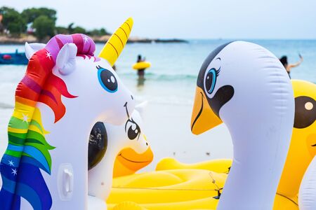 Rayong, Thailand - May, 10, 2019 : Animal figure swim tube on the beach Inflatable animal.Fantasy Swim Ring for Summer sea Trip on the beach at the Koh Samet island, Rayong, Thailandのeditorial素材