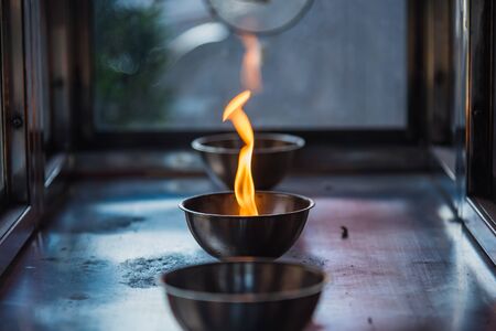 Candle flame on the lantern in Chinese temple.Thailandの写真素材