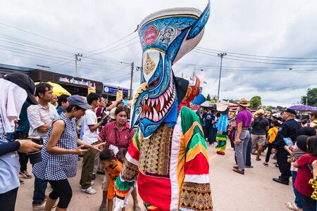 Loei province, Thailand -  July, 06, 2019 : Ghost Festival Phi Ta Khon. People are enjoy dressing with colorful clothes made from wood hand make  in Loei province Thailandのeditorial素材