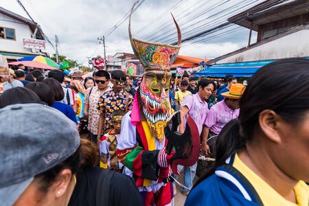 Loei province ,Thailand -  July, 06, 2019 : Ghost Festival Phi Ta Khon.People are enjoy dressing with colorful clothes made from wood hand make  in Loei province ,Thailandのeditorial素材