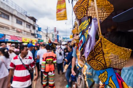 Loei province, Thailand -  July, 06, 2019 : Ghost Festival Phi Ta Khon. People are enjoy dressing with colorful clothes made from wood hand make  in Loei province Thailandのeditorial素材