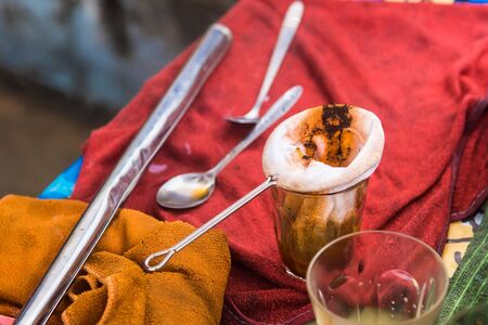 Making traditional Thai milk tea using coffee bag in Stainless Steel Pot. Old Thai tea made shop street foodの写真素材