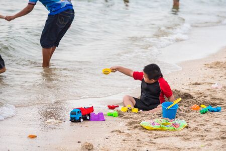 Chon Burii, Thailand - October, 05, 2019 : Unidentified name little boy play with sand on beach at Chon Burii, Thailandのeditorial素材