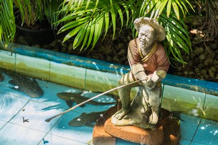 Carved sculptures made of sandstone garden ornamentsの写真素材
