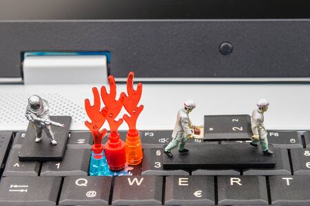 Firefighters and rescue teams on keyboard computer laptop.Computer equipment.Computer repair conceptの写真素材