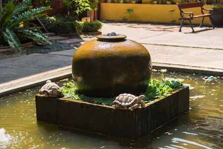 Close up jar fountain in the gardenの写真素材