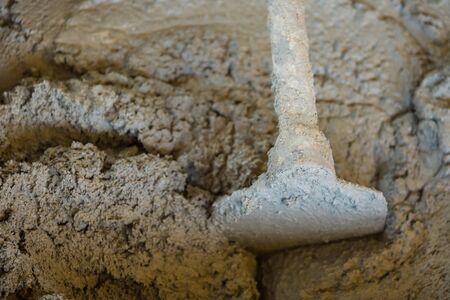 Bucket cement mix with on construction site the ingredients. Brick, Stone, Mortar, Sandの写真素材