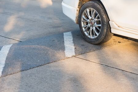 The hill reduces the speed of the car on the roadの写真素材