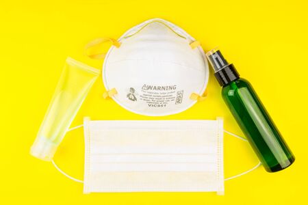 Surgical Face Mask and Alcohol gel to wash hands. Coronavirus Concept. Medical Face Mask For Stopping The Spread of Virus. Surgical mask with rubber ear straps. surgical mask to cover the mouth nose.の写真素材