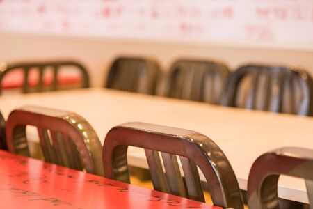 Row of vintage chairs in a restaurant.の写真素材