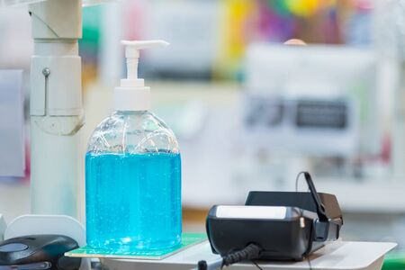 Antiseptic hand gel or alcohol gel prevent the spread of germs and bacteria and avoid infections corona virus,covid-19 prevention for serving customersの写真素材